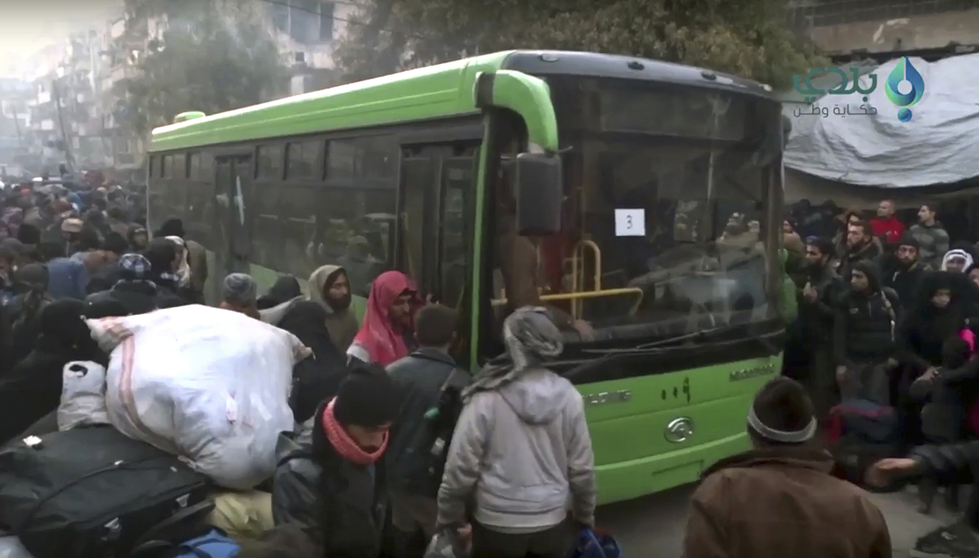 Bloodied and demoralized Syrians evacuate Aleppo