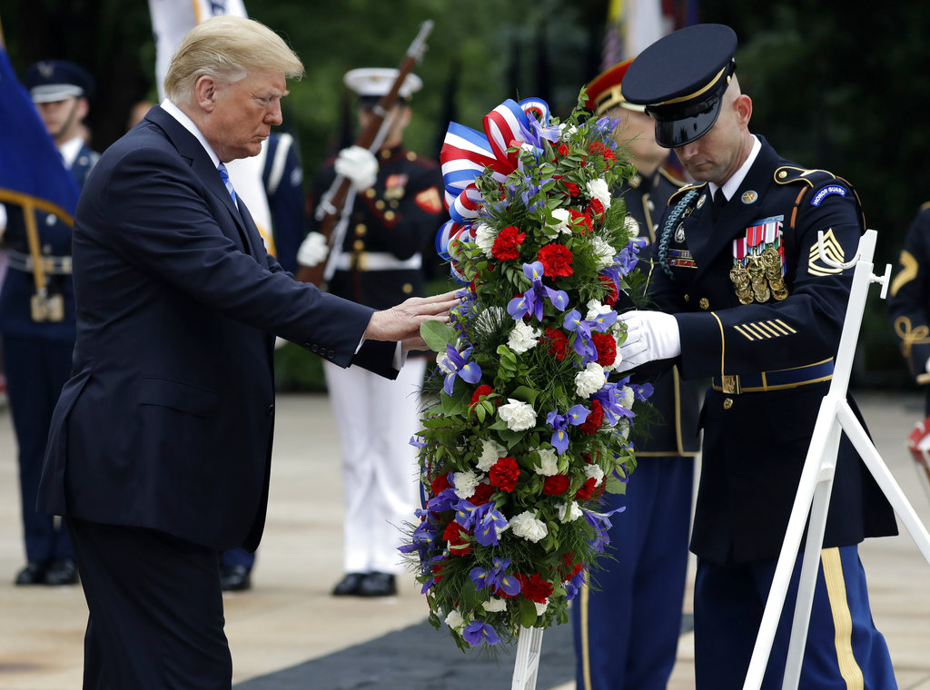 On 'sacred soil,' Trump lauds those who've fallen in service