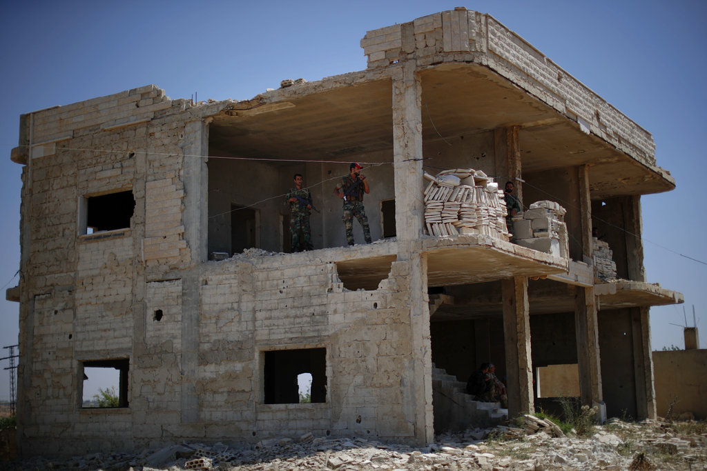 Displaced Syrians march close to Israel; airstrike kills 10