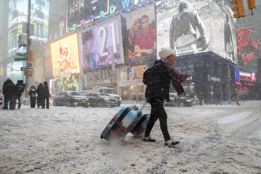 Massive storm roars into East Coast; record cold to follow