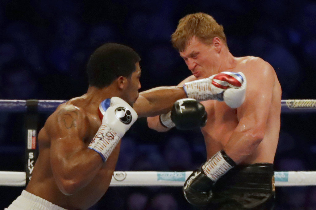 Joshua stops Povetkin in 7th round, keeps heavyweight titles