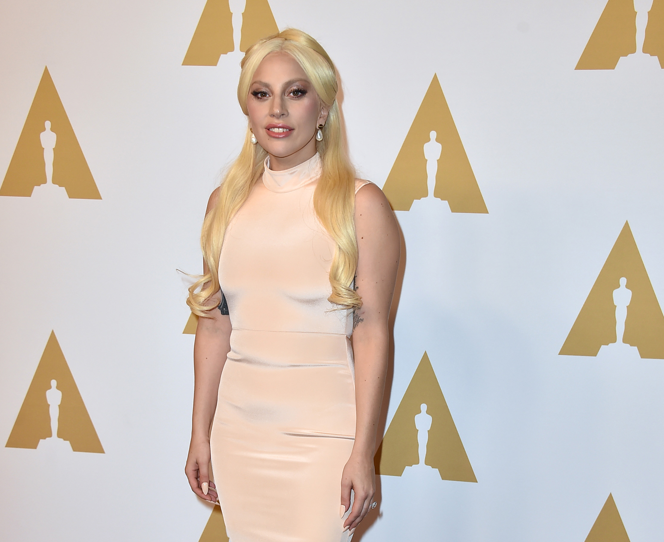 Gaga says assault won't define her after Oscar performance