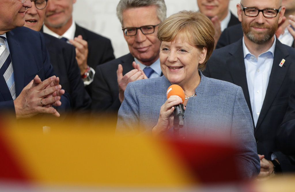 Merkel wins 4th term but nationalists surge in German vote